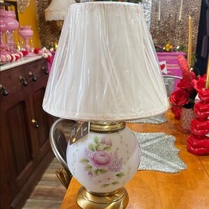 New with tags and lampshade still I. Plastic.  Fenton lamp